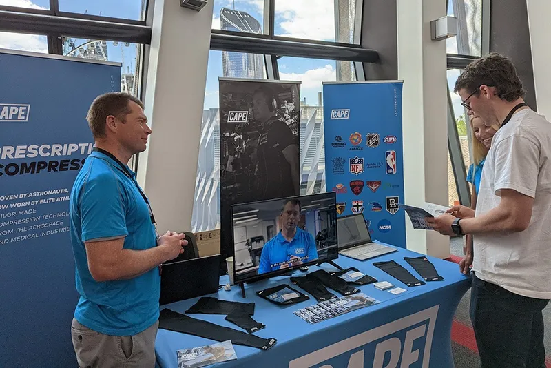 CAPE booth meeting clinicians